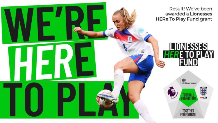 A picture of Georgia Stanway battling in action for the England Lionesses with the text 'We're HERE to play' in bold letters